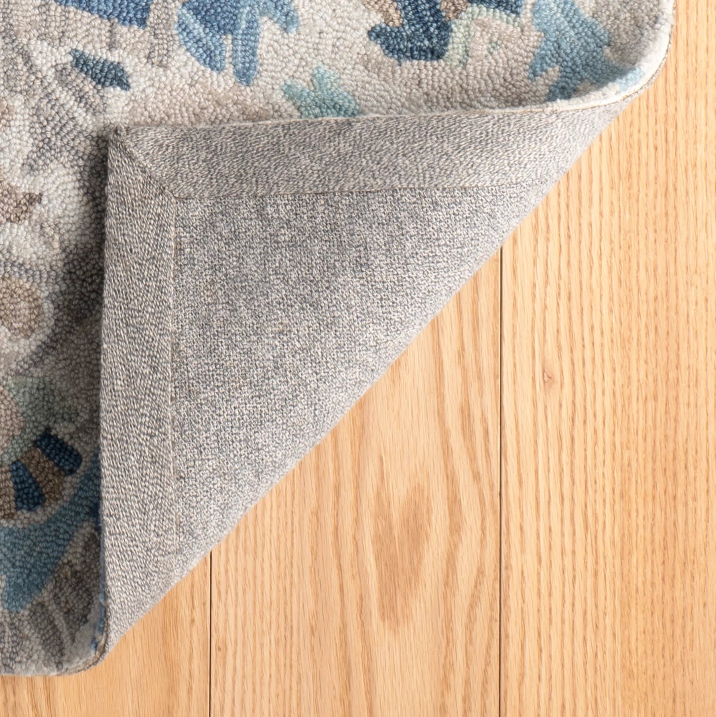 ines hand micro hooked wool rug | blue ines hand micro hooked wool rug | blue